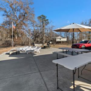 View of the property featuring fencing, a gazebo a