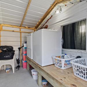 Laundry room with conveying washer and dryer