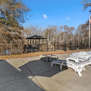 View of patio area featuring a gazebo and an outdo