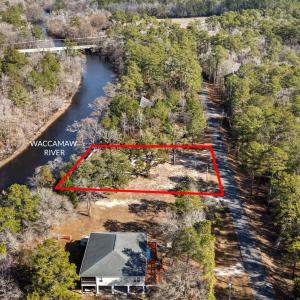 Aerial view of property and surrounding area with