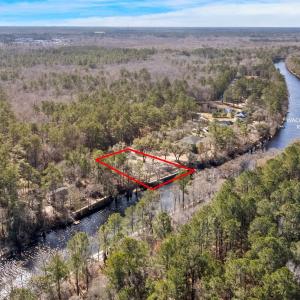 Aerial view of property's location with a nearby b