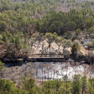 Aerial view of property and surrounding area with