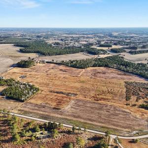 Aerial view of property and surrounding area with