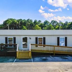 View of property with uncovered parking