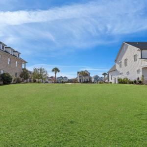 View of grassy yard with a residential view and co