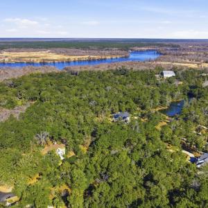 Drone / aerial view of a heavily wooded area and a