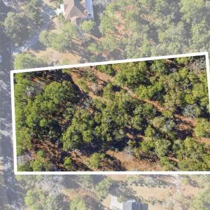 Aerial view of property and surrounding area with