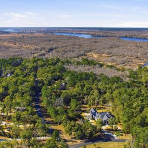 View of property location with a forest and a larg