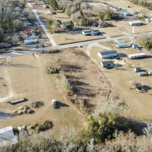 Aerial view of property and surrounding area with