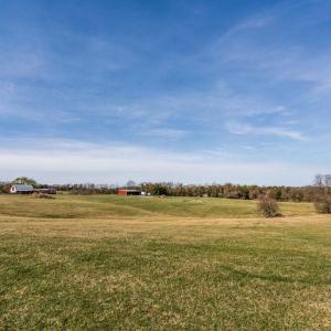 looking back to pole shed on west side and new building on SE side of property.