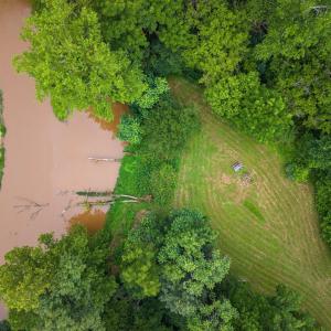 Aerial view of creekside clearing