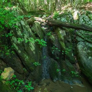 Small waterfall over natural rock