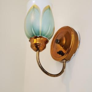 art glass sconce in stairhall