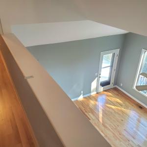 new flooring upper level Hall and LR