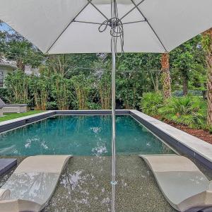 Pool Lounge area with umbrella