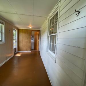 Sun porch to laundry room and rear yard.