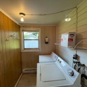 Separate laundry room off of sun porch.