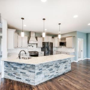 Gorgeous main-level kitchen with granite countertops, pot filler, stainless steel appliances, and more!