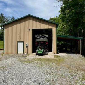 Pole barn with loft that can store your motor home/camper.  Has electric, diesel tank, and water storage with sink.