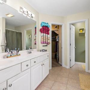 Primary suite bathroom~ separate commode room, shower and bathtub, walk-in closet.