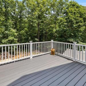 The seller is a builder and has done a lot of work to things over the years. This deck was recently refurbished with new trex flooring and new railing.