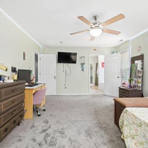 Another shot of the bedroom with the bathroom and closet through the door