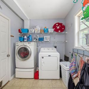 The door to the 2 car garage is here to the left of the washing machine