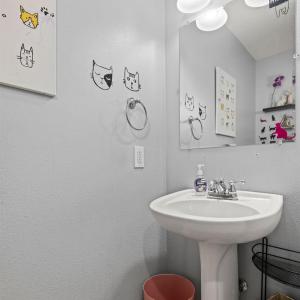 The main floor half bath is in the middle of the hall way from front door to LR