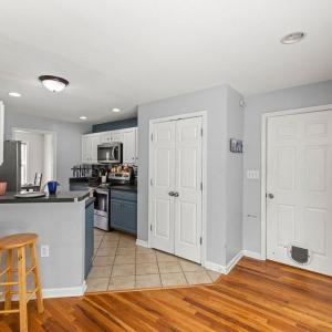 The breakfast bar makes the transition between the LR and kitchen. Pantry is spacious! This is the door to the laundry room.