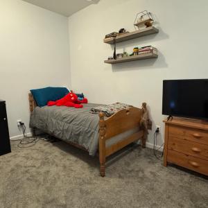 This room currently has a window but not a closet. It would be easy to add one here OR you could use the one under the stairs or in another room down the hall from here.