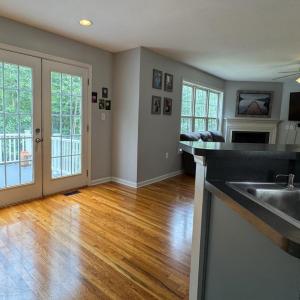The beautiful hardwood floors are throughout the downstairs are in great condition. The kitchen floor is tile.