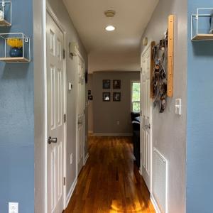 The hallway leading from the front door to the LR