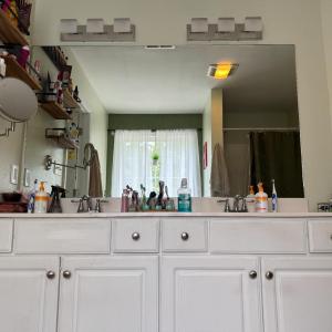 Pretty vanity with lots of cabinets, drawers and counter space.