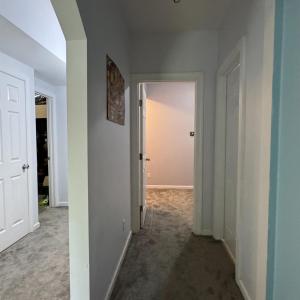 Down the hall on the right is theh 3rd full bathroom! On the other side of this wall is a hallway to the 2 storage rooms.