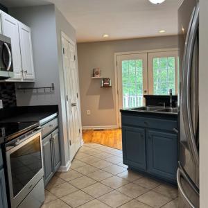 Showing the refrigerator on the right and the sink is at an angle so there is a good space for the seating island on the back side of it.