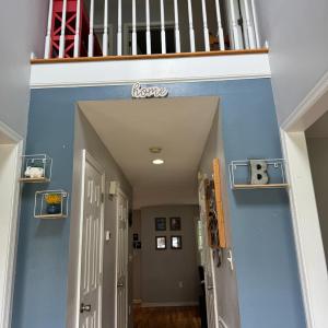 The foyer has a two story hallway for the massive window letting in light from the upstairs!