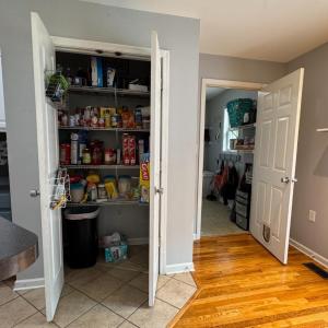 The wonderful large pantry closet! And the door to the laundry room on the right which also leads to the 2-car garage! W/D convey. Seller put lots of shelves in the laundry room, the storage room, the garage.