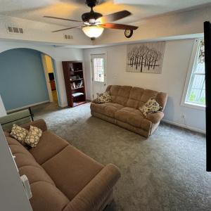 Accessed from the door in the center hallway, now heading down to the comfortable den in the finished basement.