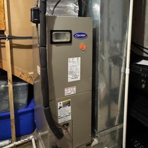 The mechanical room has still more storage space and large shelves! Here is the heat pump (Carrier) which was replaced 5 years ago.