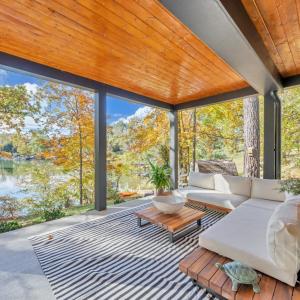 Terrace level, covered entertaining space is perfect for a quiet retreat for your guest and family!