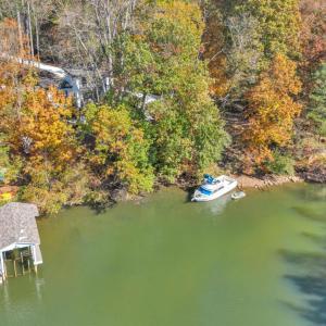 Tucked away in a private uncluttered cove perfect for floating and family fun! The brand new contemporary dock will be completed by spring! Renderings are available to serious buyers!