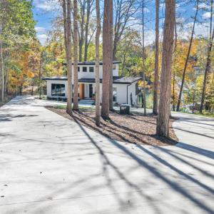 One of the few properties on County Sewer!  Offers a long concrete driveway with tons of parking for family and guest! Literally walking distance to several area restaurants!