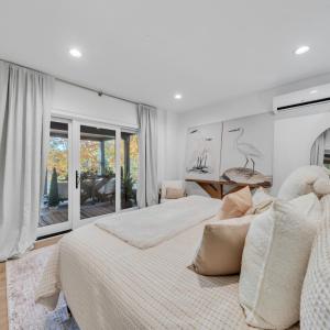 Terrace level bedroom with private covered outdoor space overlooking the lake!