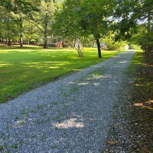 the long gravel driveway offers seclusion