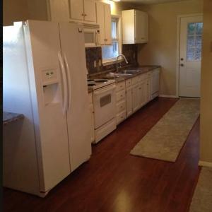 To protect tenants' privacy, this picture is not current. Microwave and dishwasher are now stainless steel.
