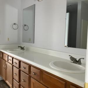 Upstairs bathroom with double sinks and vanity