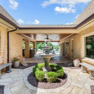 Outdoor bathroom in courtyard to accommodate pool