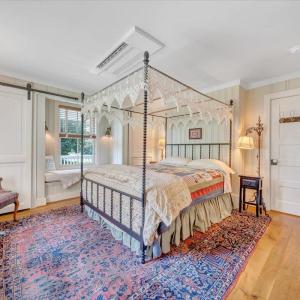Furniture, lighting, and doors are original to the house, complimented by new closets and a window seat with storage underneath.