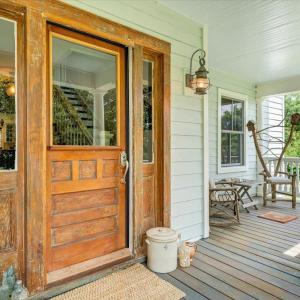 While modern updates have been added for comfort, the original front door has been lovingly preserved, honoring the home's timeless character.