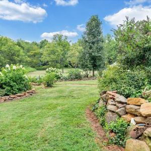 Original rocks found throughout the property were thoughtfully incorporated into the perennial gardens.